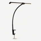 Black LED desk lamp with secure screw clamp on a light neutral background
