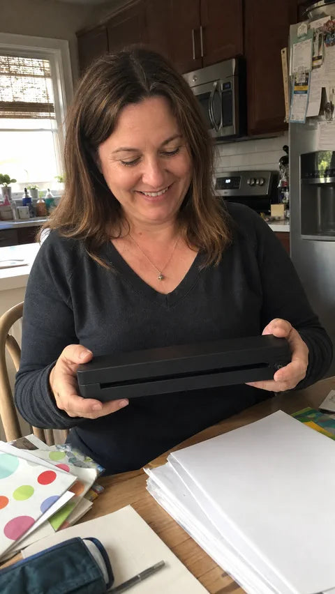 Teacher using the black PAUD portable printer